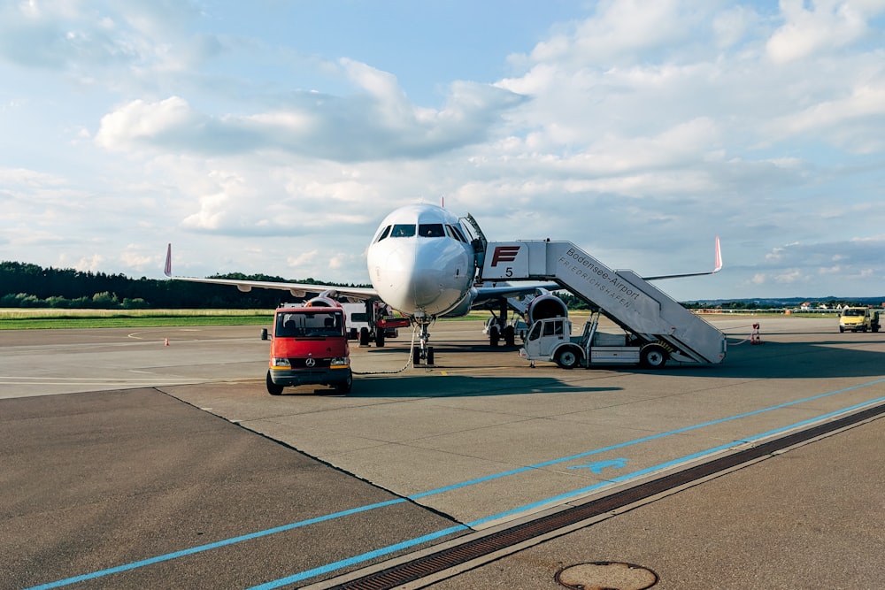 white passenger plane on runway