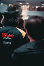 Security personnel attentively scanning a busy shopping center entrance.