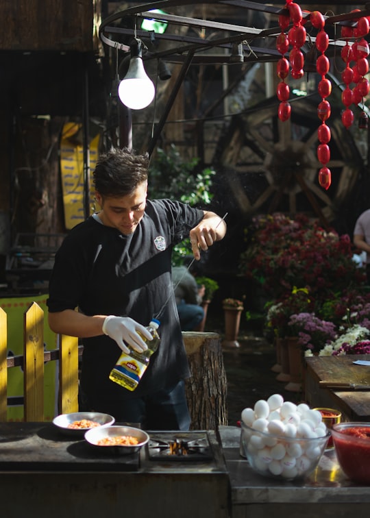 man holding knife in Darband Iran