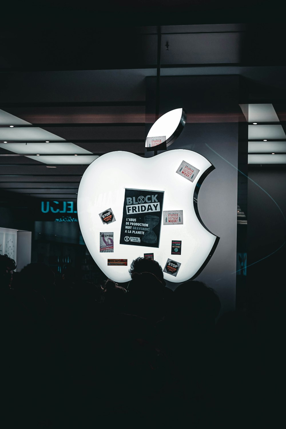 an apple advertisement is displayed in a dark room