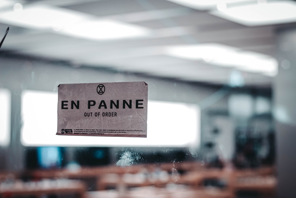 a sign hanging from the ceiling of a restaurant