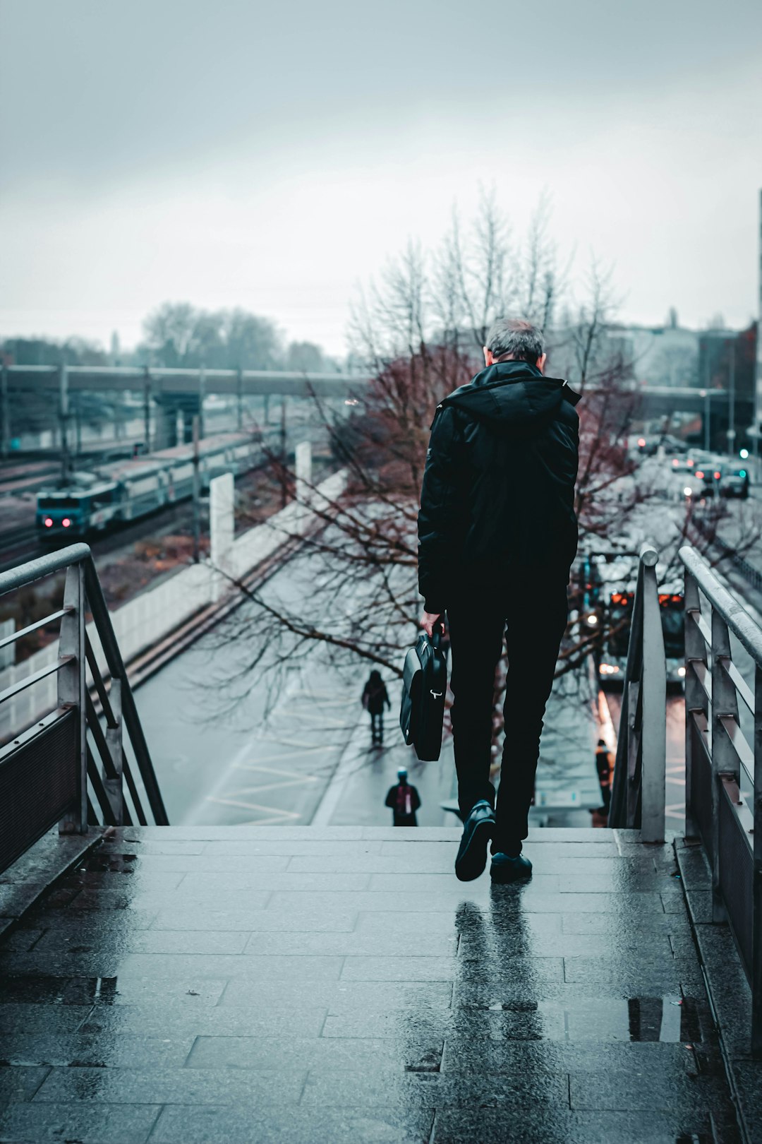 person by concrete stairs during foggy weather