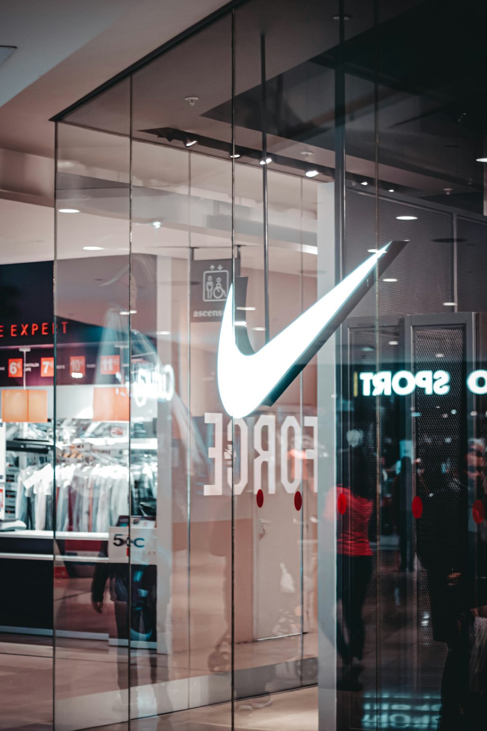 Nike lighting logo on glass panel