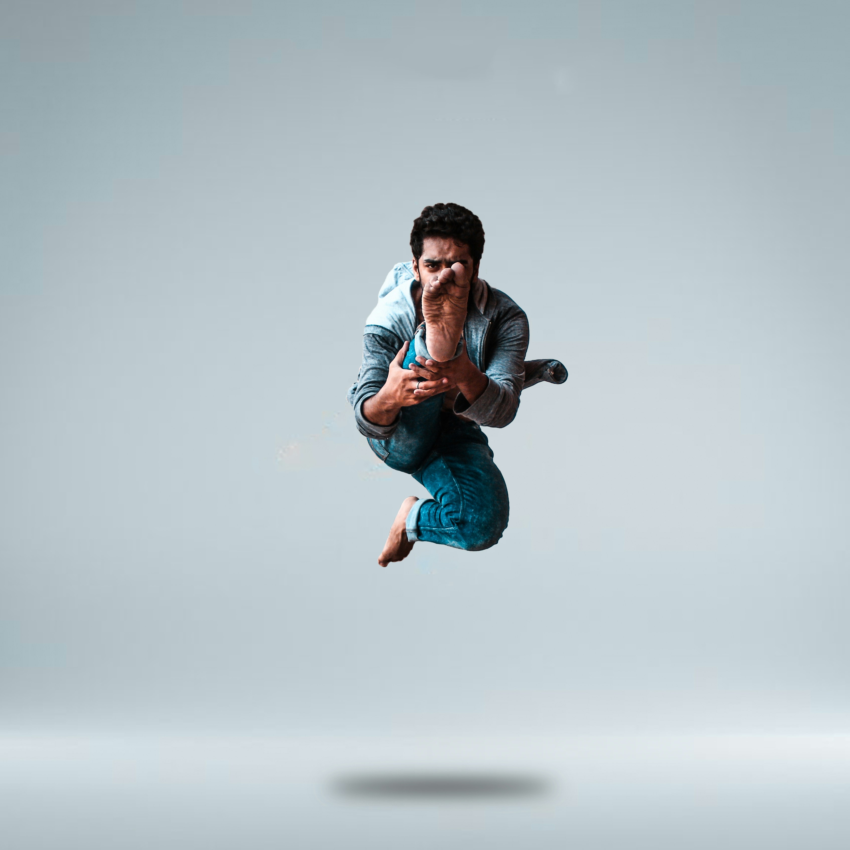 selective focus photography of jumping man