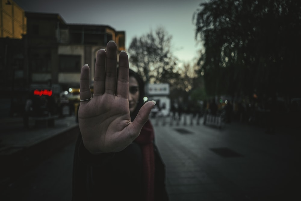 woman raising hand