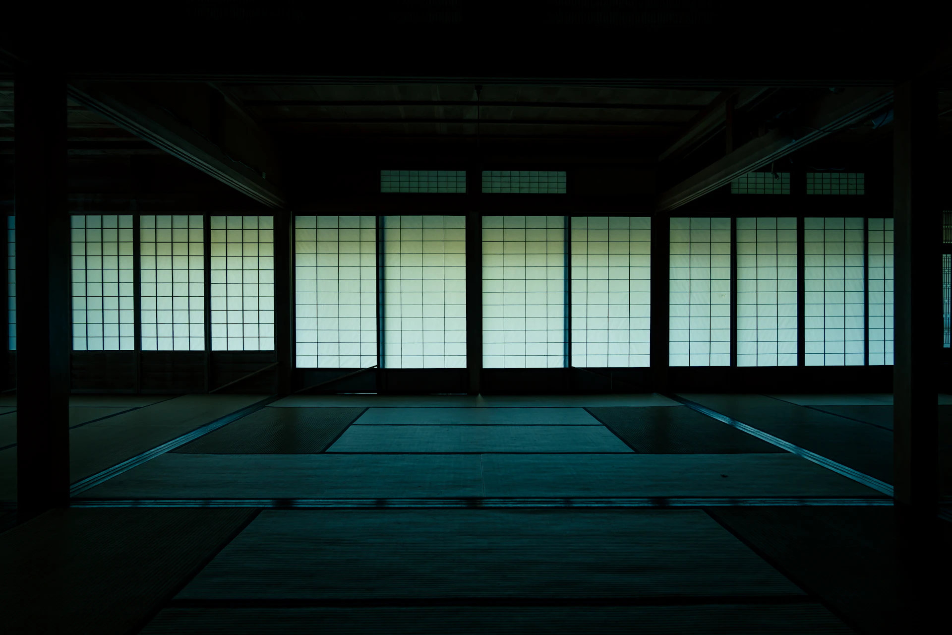 A dim tatami room with shoji screens