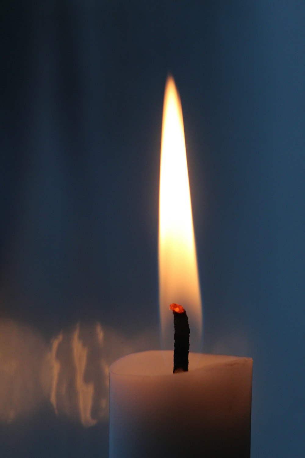 selective focus photography of lighterd candle