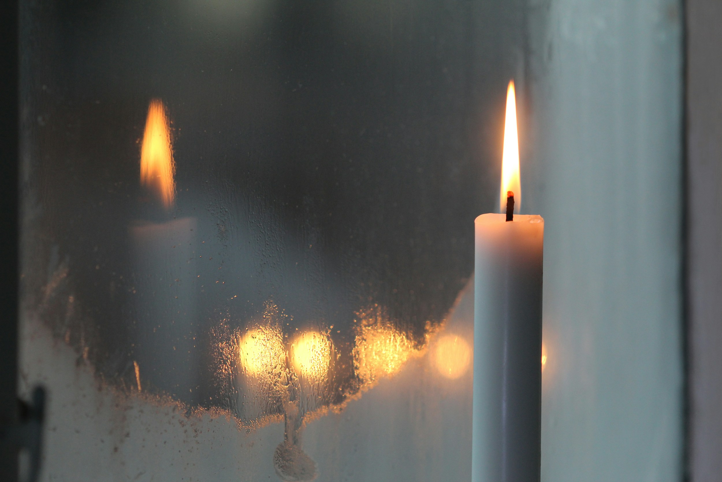 candle light dark window evening