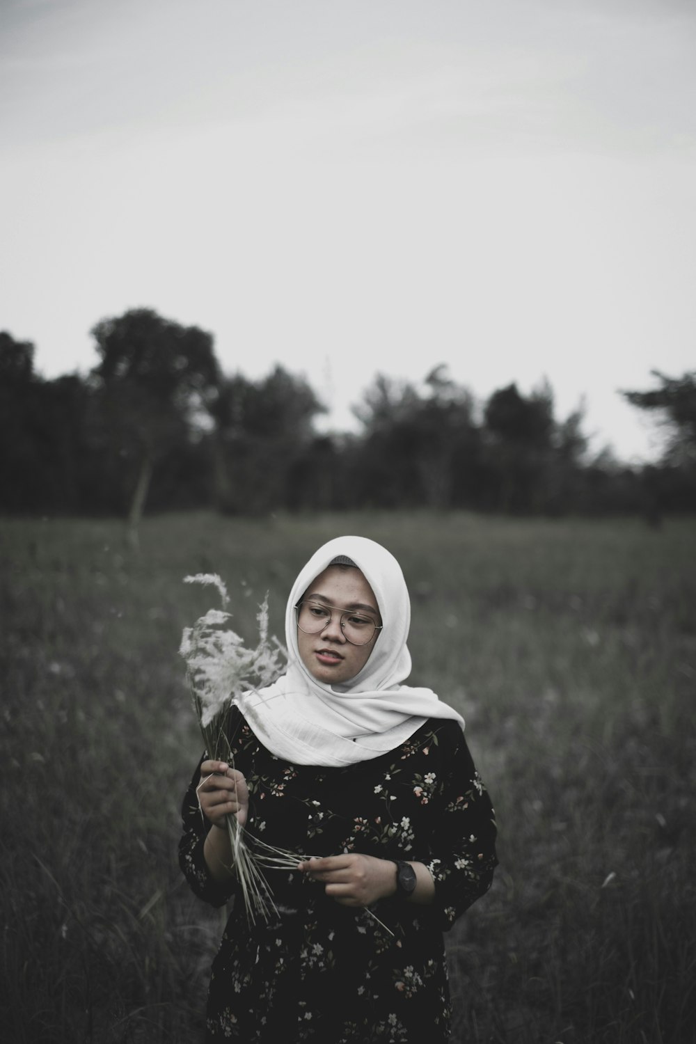 woman holding flowers