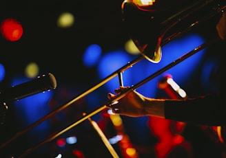 a close up of a person playing a trombone