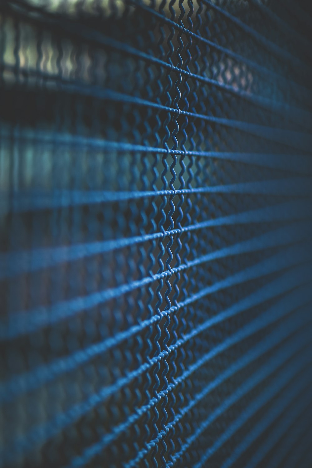 a close up of a window with blue blinds