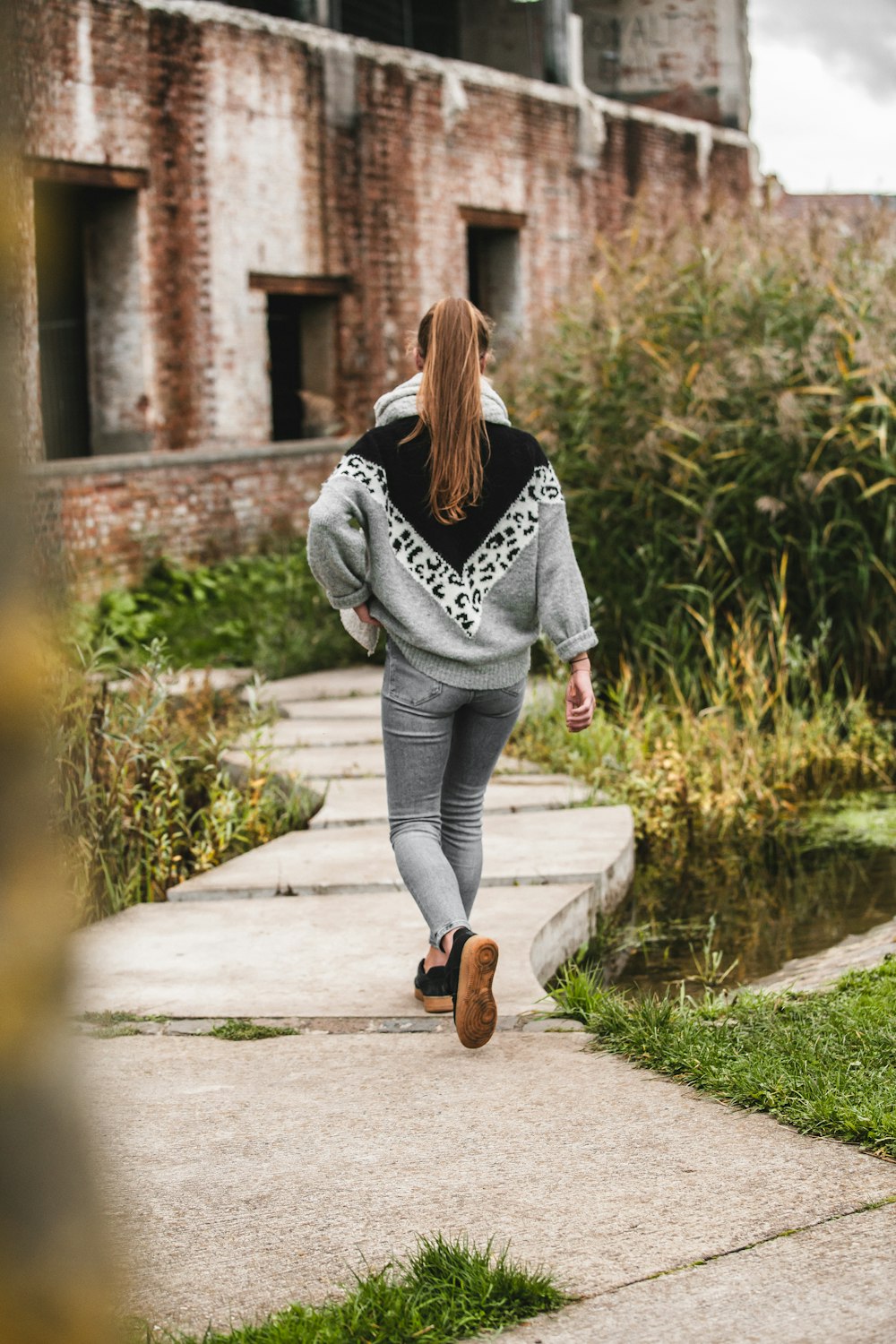 woman walking on pathway