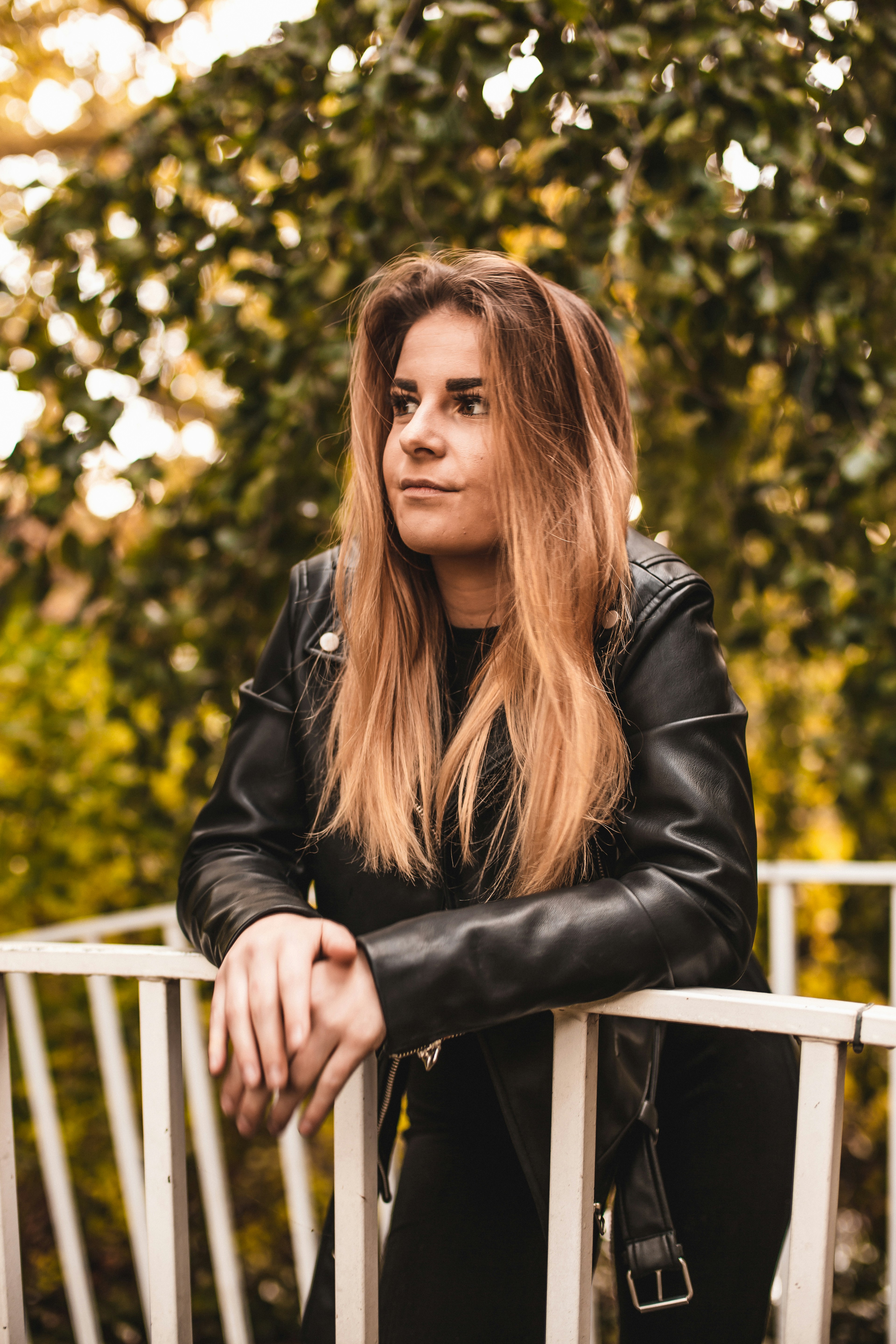 woman wearing black leather jacket