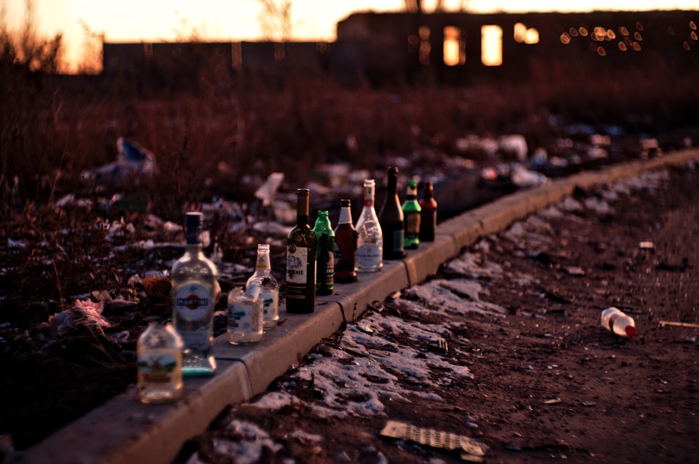 bottles on brown concrete surface