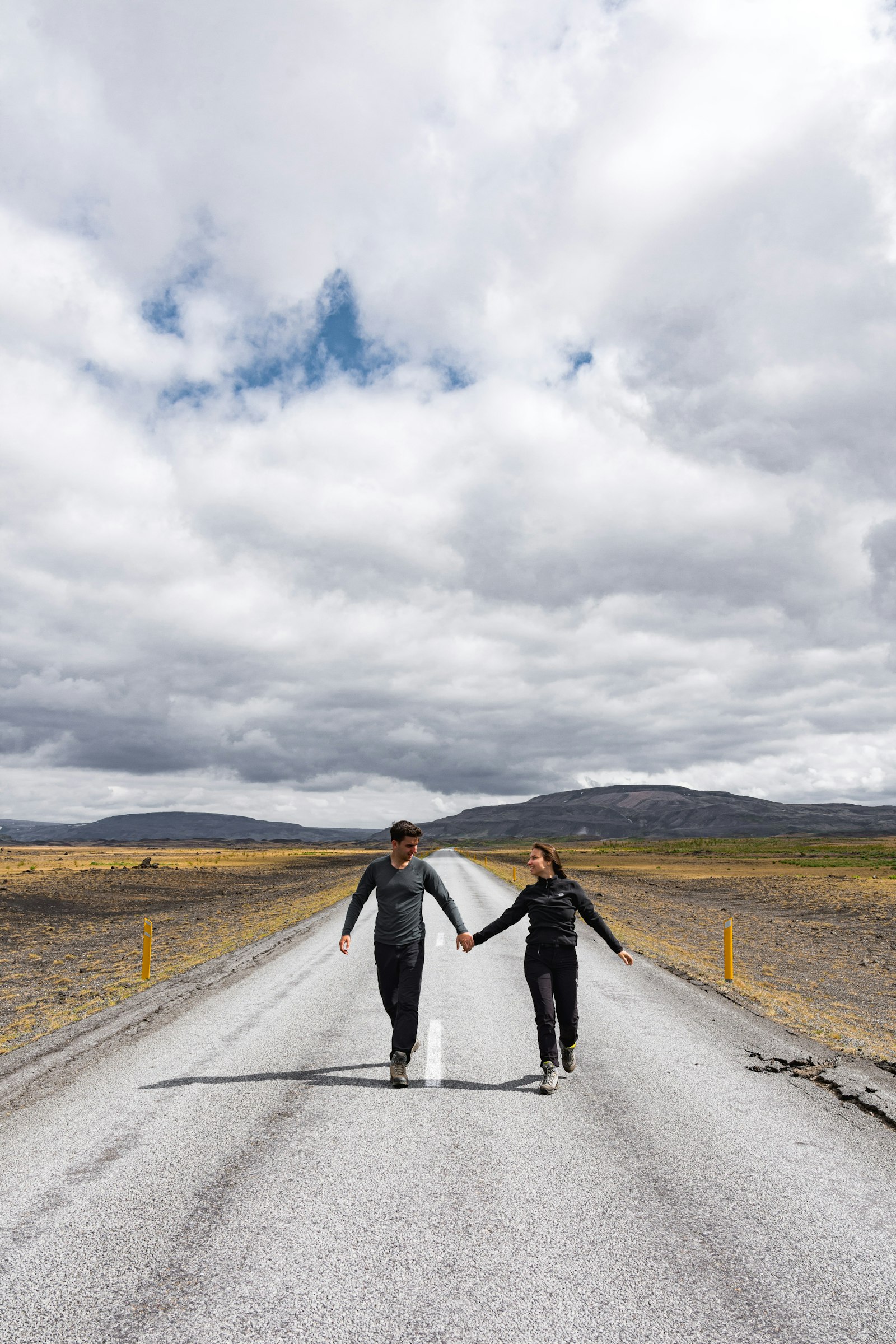 Nikon D7200 + Sigma 17-50mm F2.8 EX DC OS HSM sample photo. Couple walking on road photography