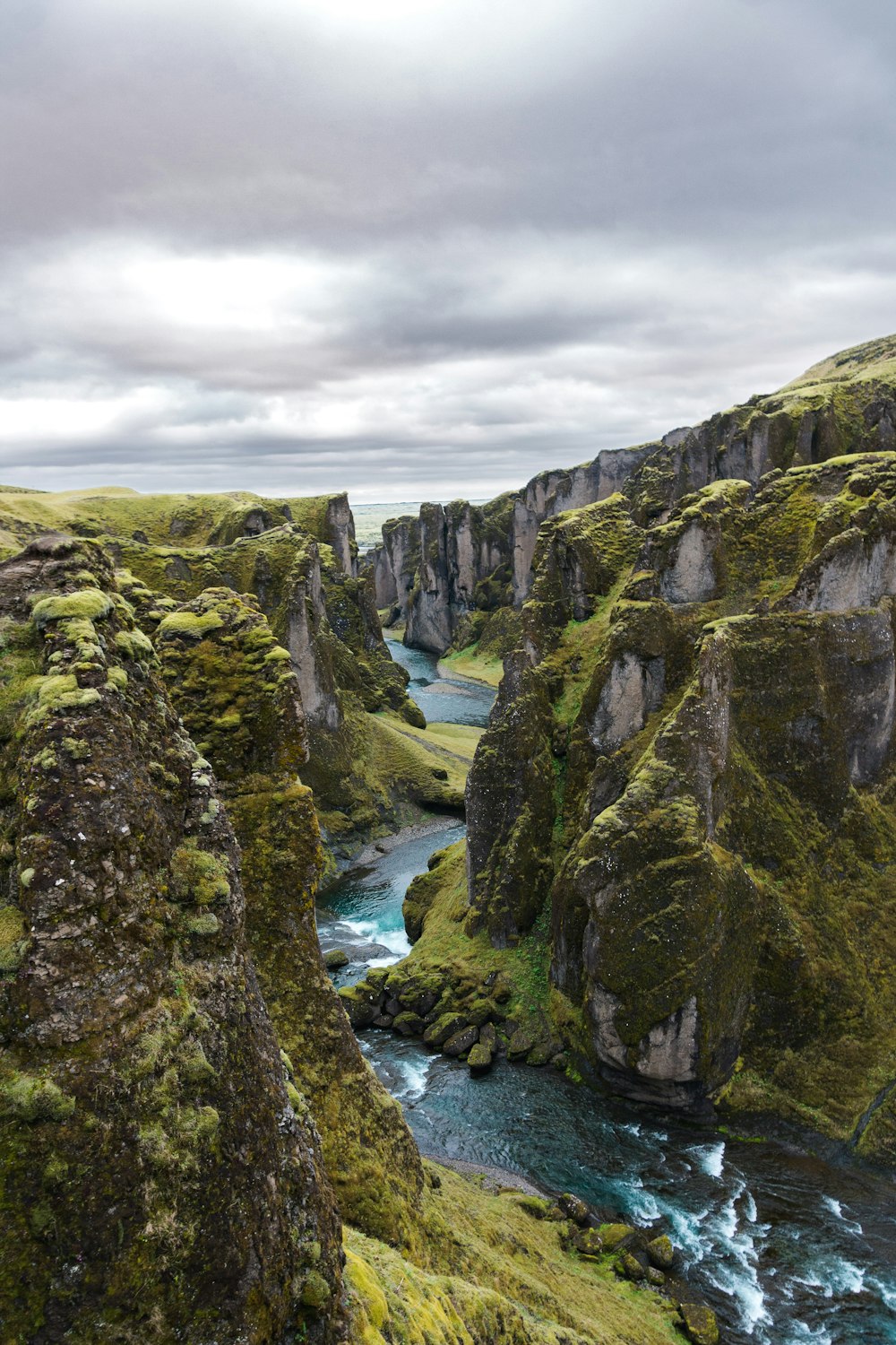 water stream under grey sky