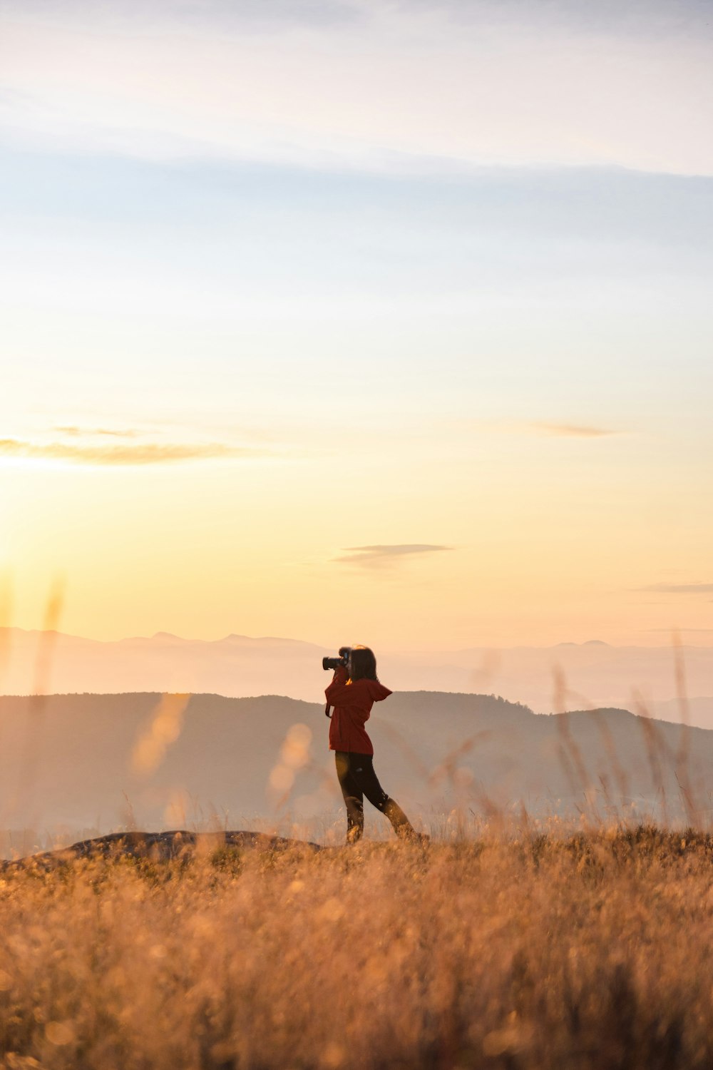 woman standing on brown field