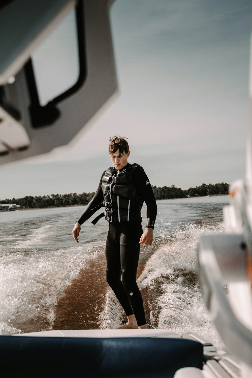 selective focus photography of man doing wakeboard during daytime