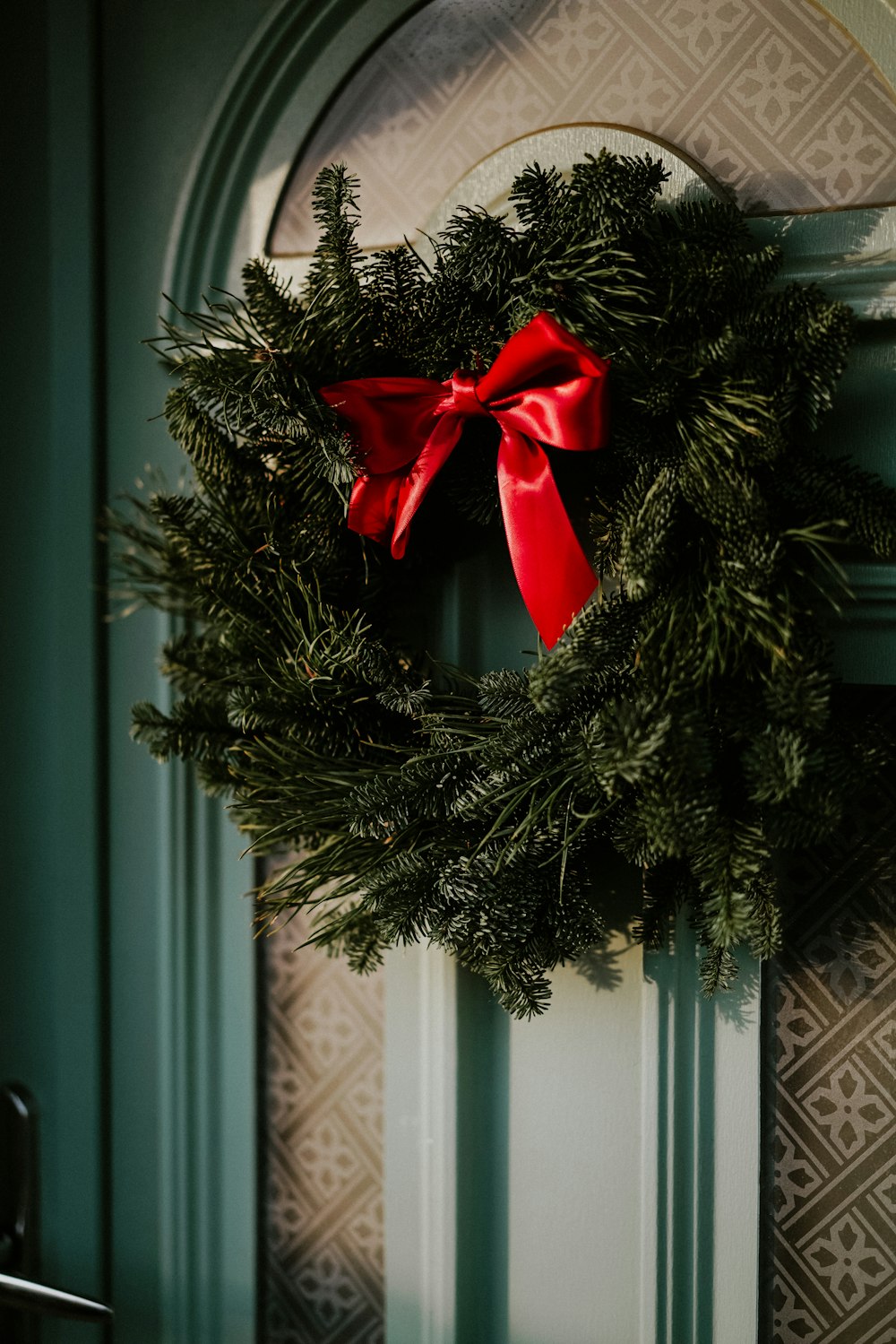 green door wreath on door