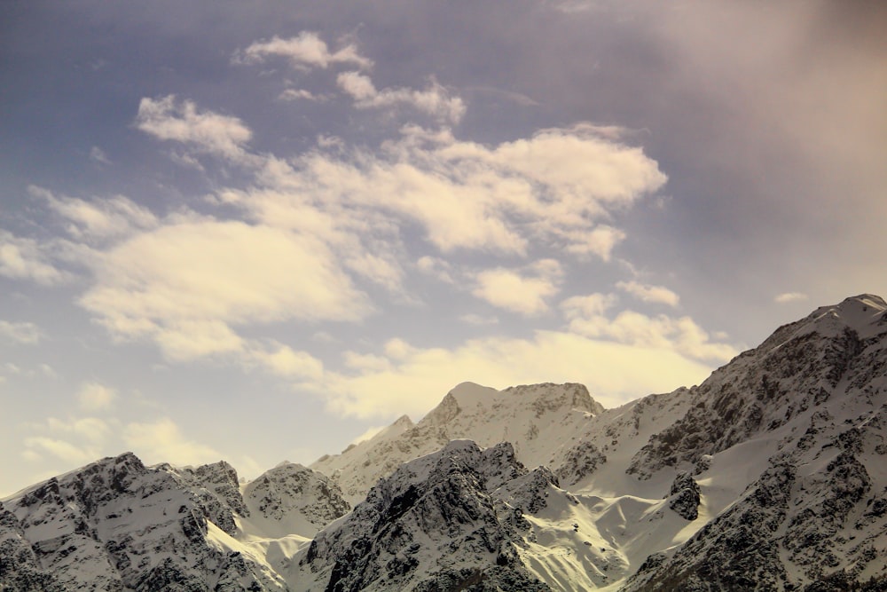 white clouds over mountains