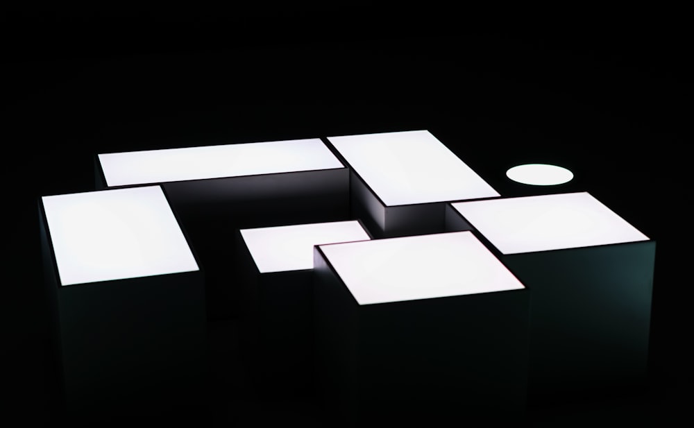 a group of cubes sitting on top of a black surface