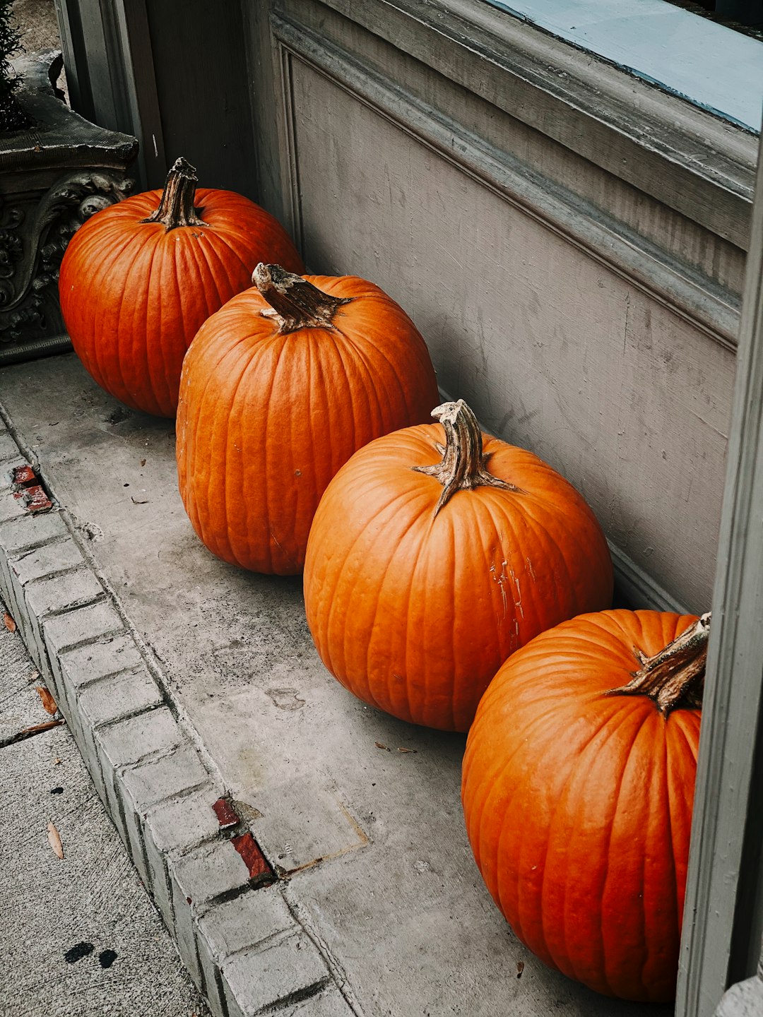 four orange pumpkins