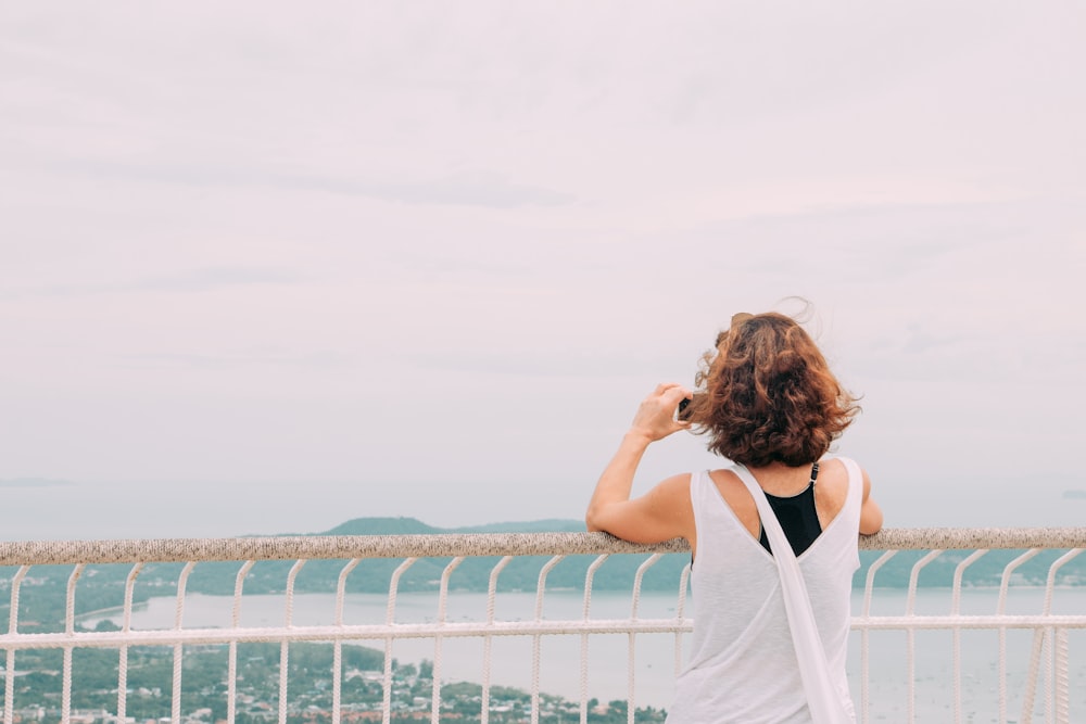 woman standing near fence