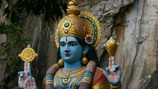 blue and gold deity statue
