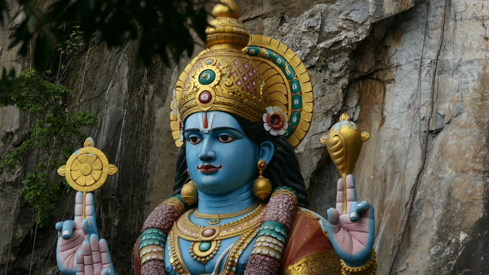 blue and gold deity statue