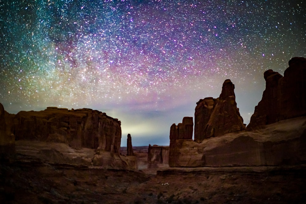 landscape under purple and green sky