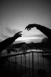 grayscale photo of hands
