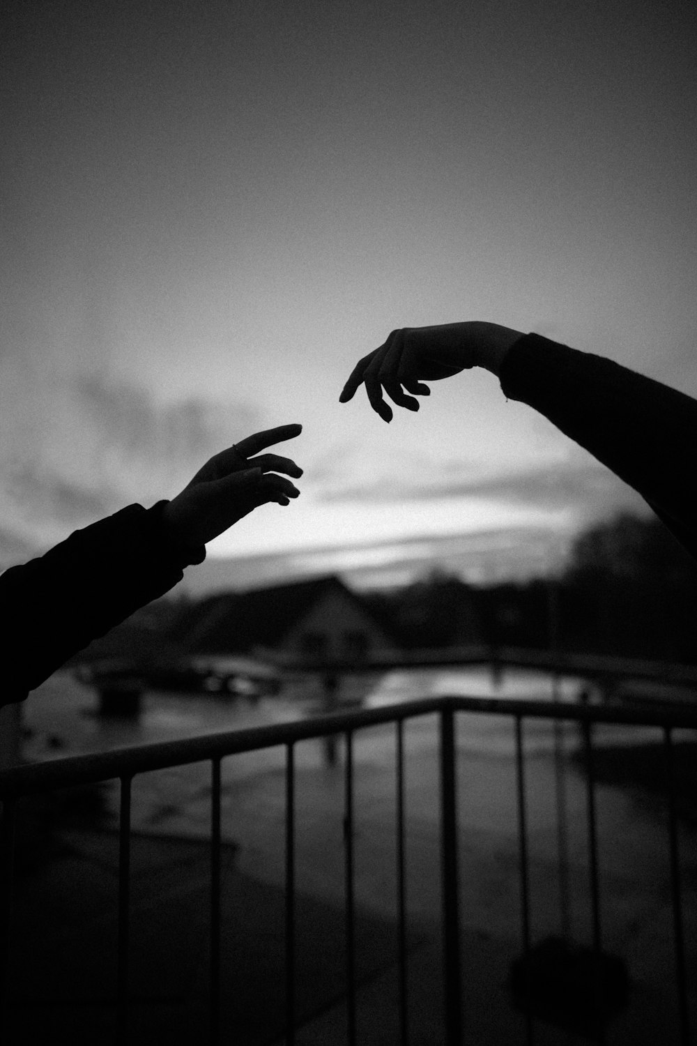 grayscale photo of hands