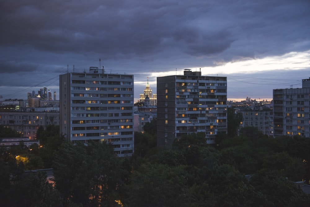 high-rise buildings under grey sky