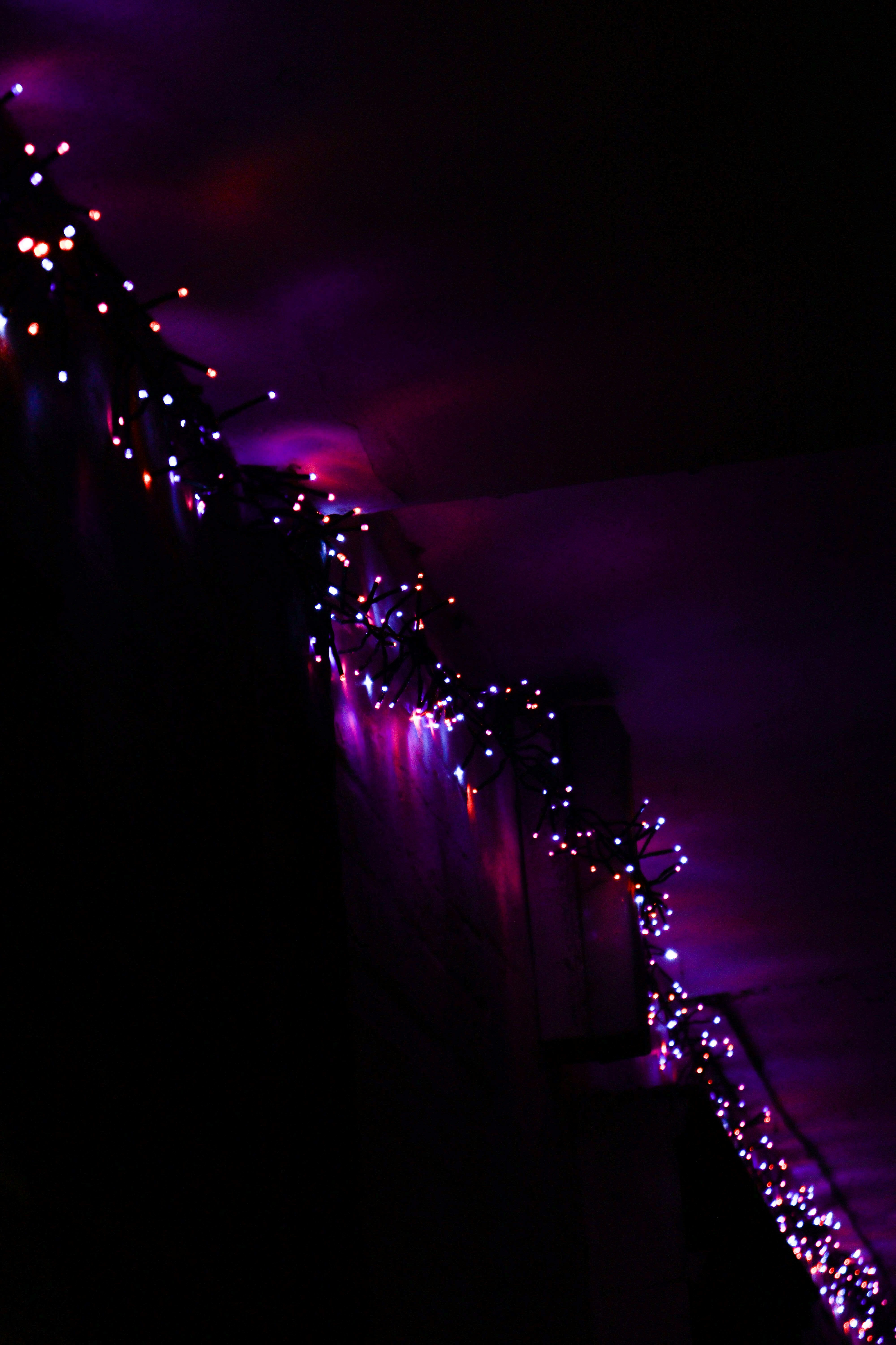 a long line of lights on the side of a building