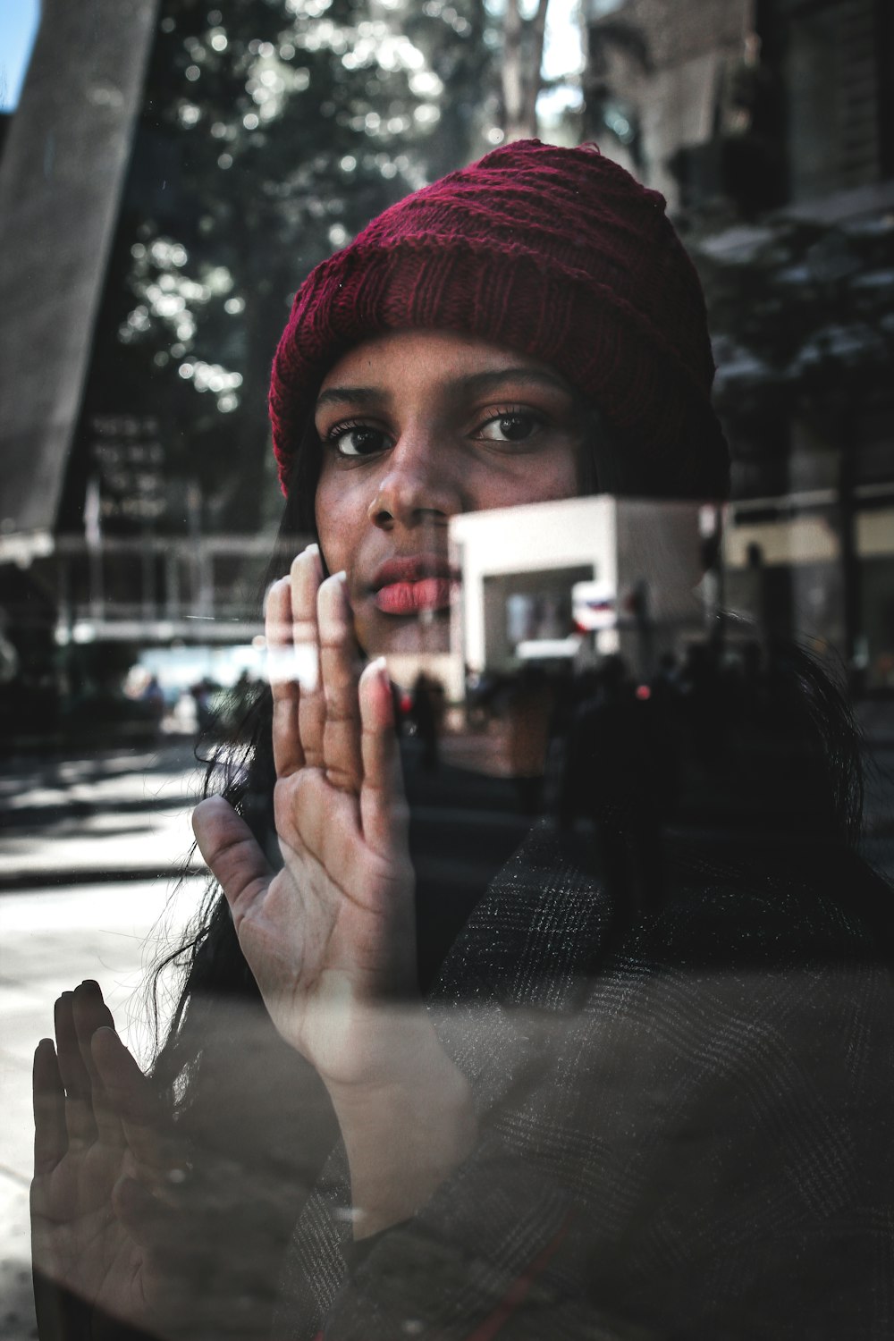 woman near clear glass wall