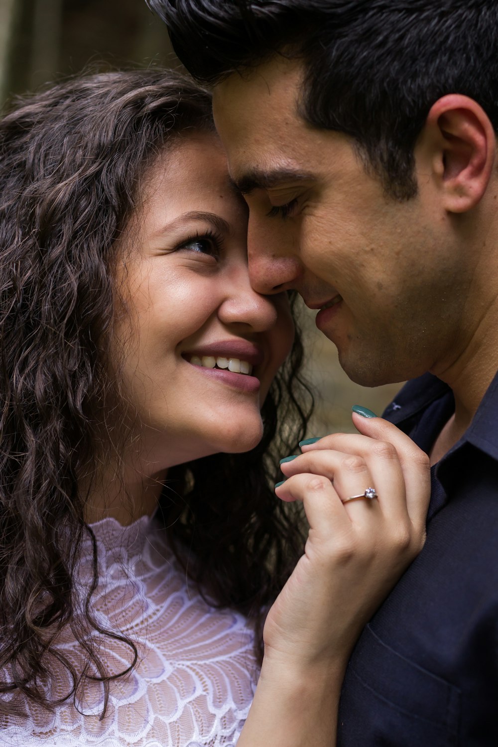 close-up photography of smiling man and woman during daytime