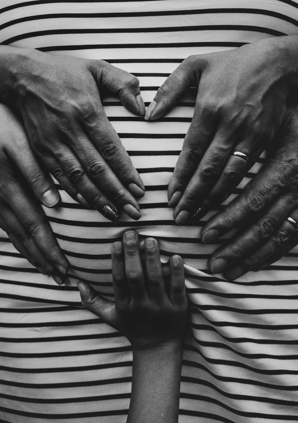 grayscale photography of human hands