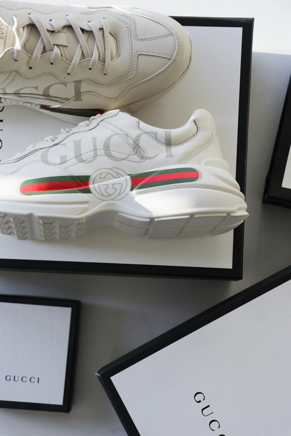 pair of white-red-green Gucci sneakers with box