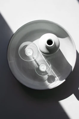 Minimalist artistic arrangement of event accessories in ivory and cacao shades.