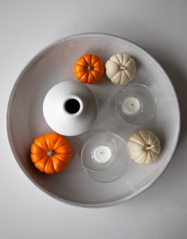 tray of pumpkins and candles