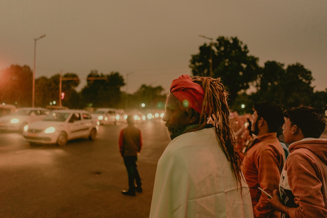 people beside road in city