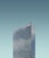 A tall, modern skyscraper with reflective windows and the letters 'SAS' displayed at the top. The building stands against a clear, cloudless sky.