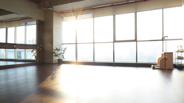 A bright and welcoming physiotherapy treatment room with modern equipment.