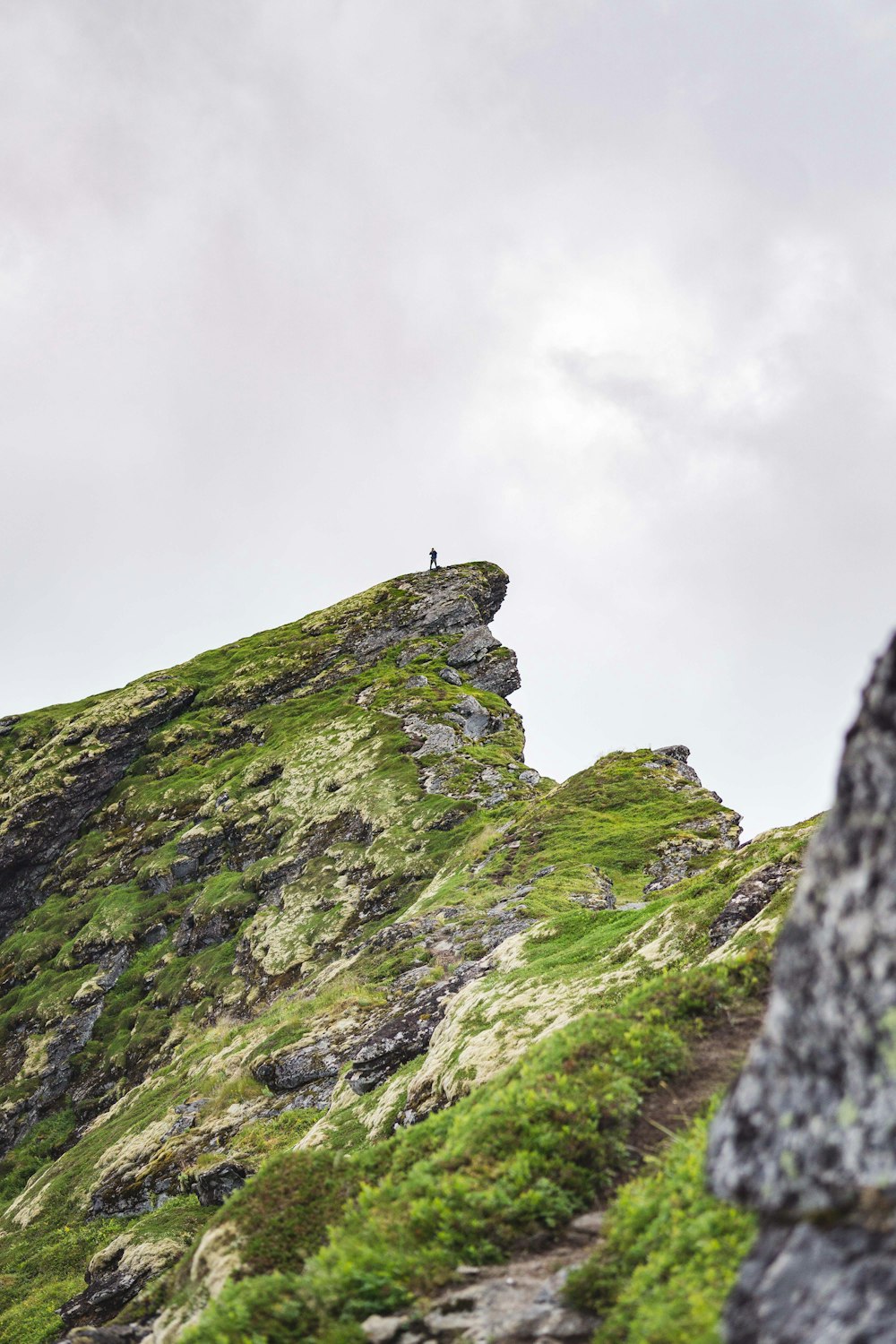 person standing on rock