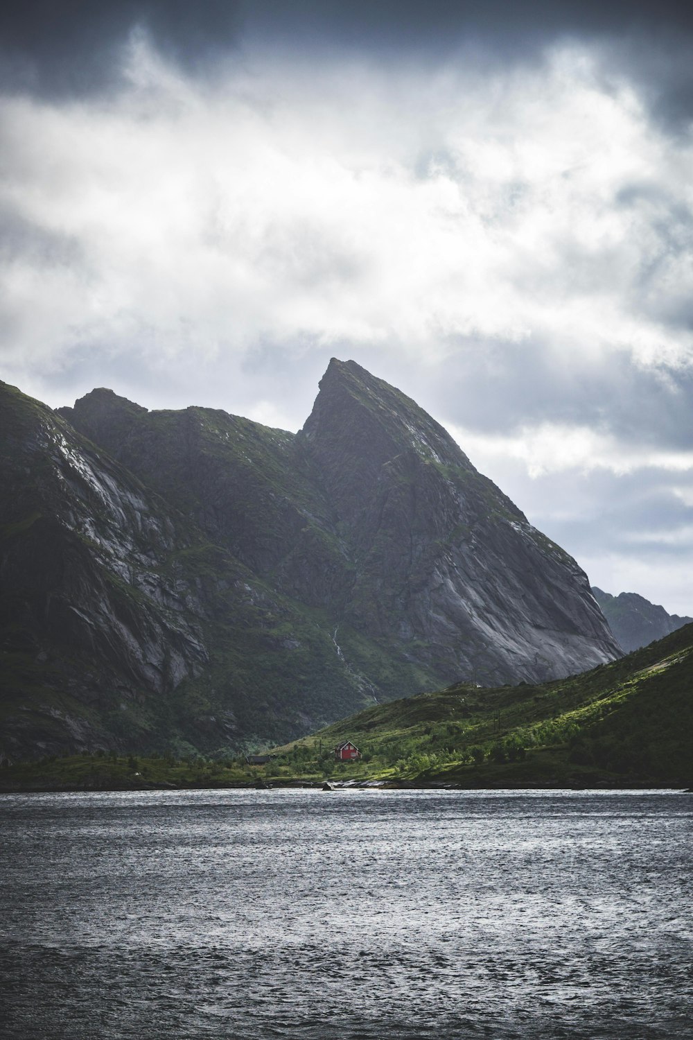 water with the distance of mountain during daytime