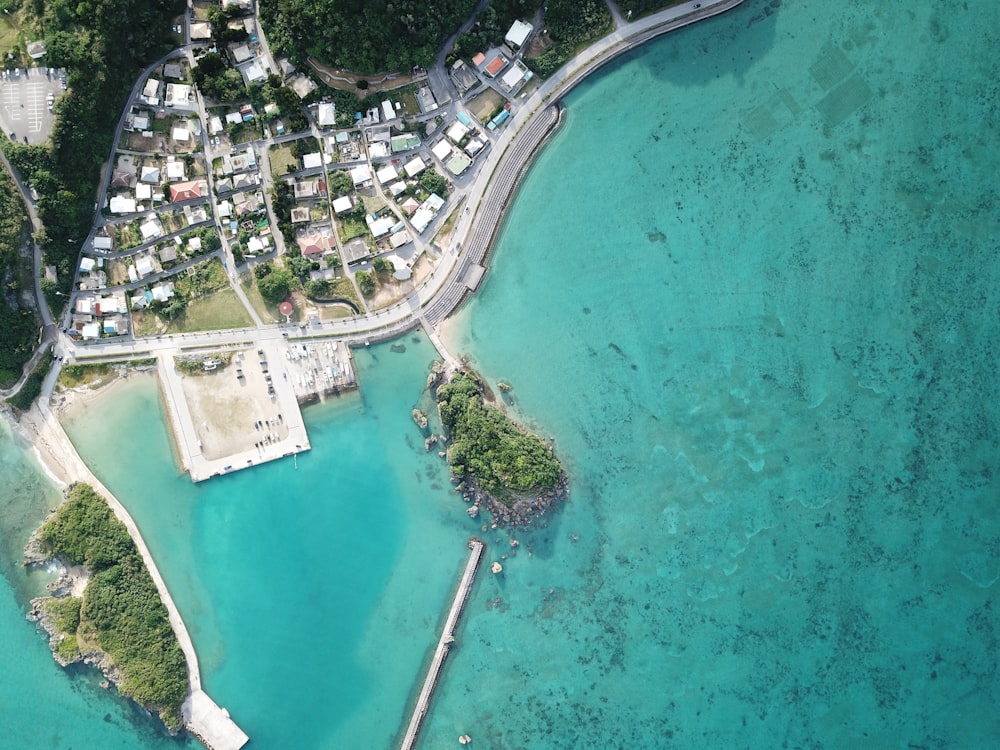 bird's eye view photography of city beside body of awter