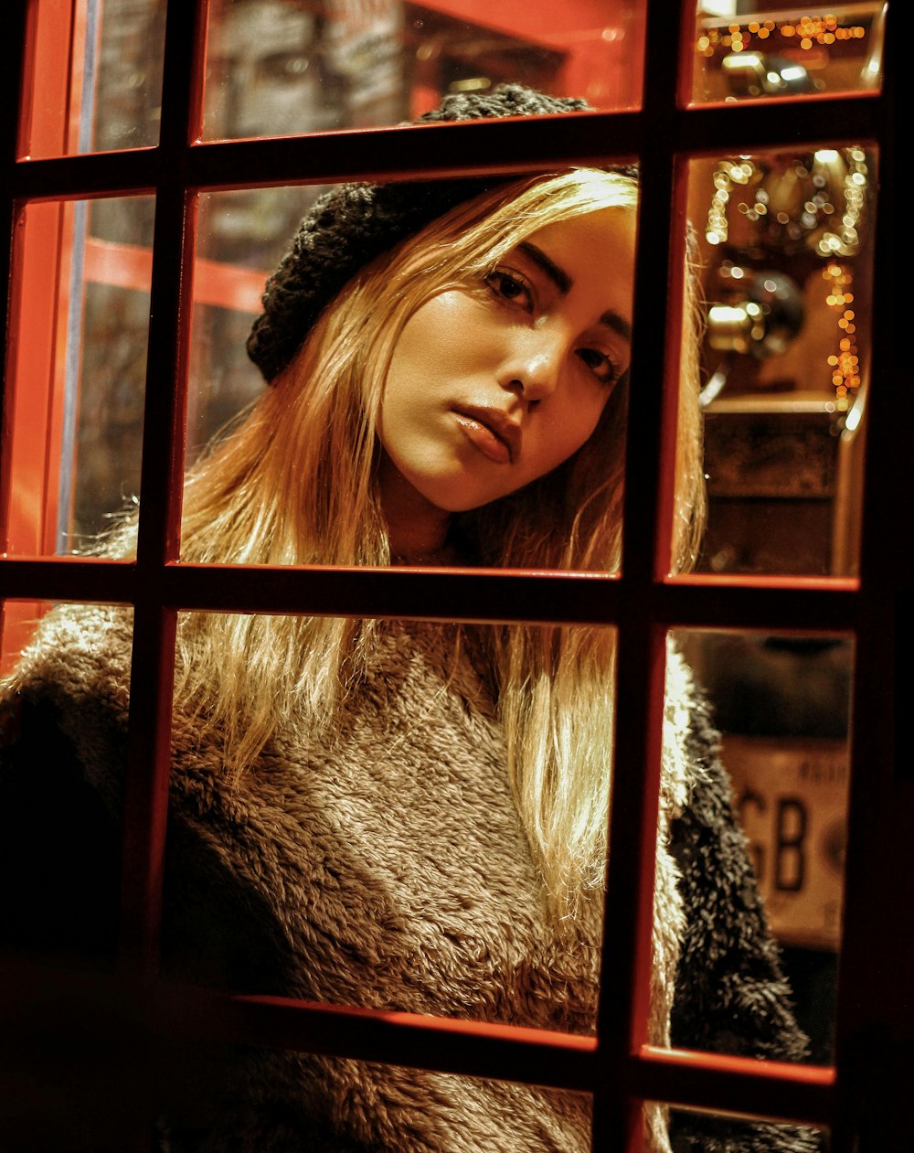 woman standing near clear glass wall