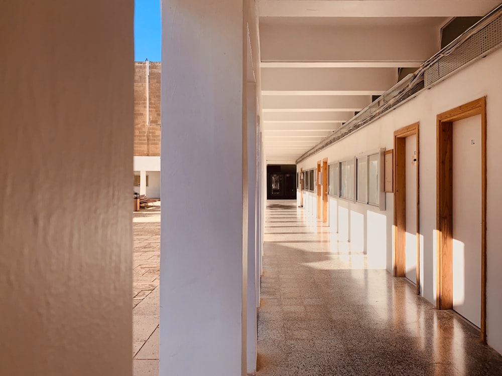 empty hallway with closed doors of building