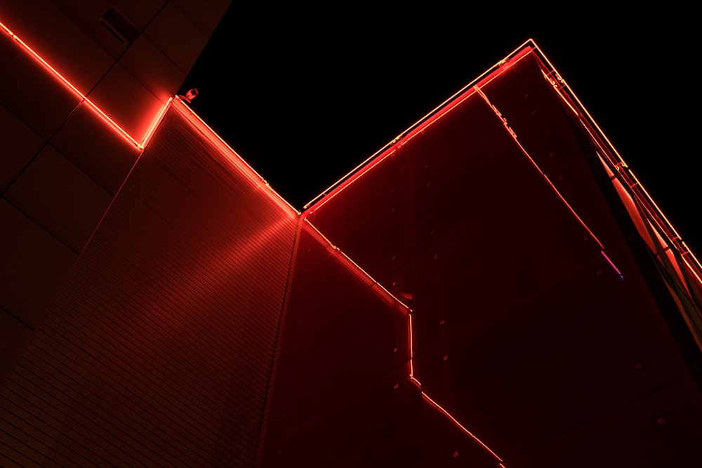 a building with red lights on the side of it