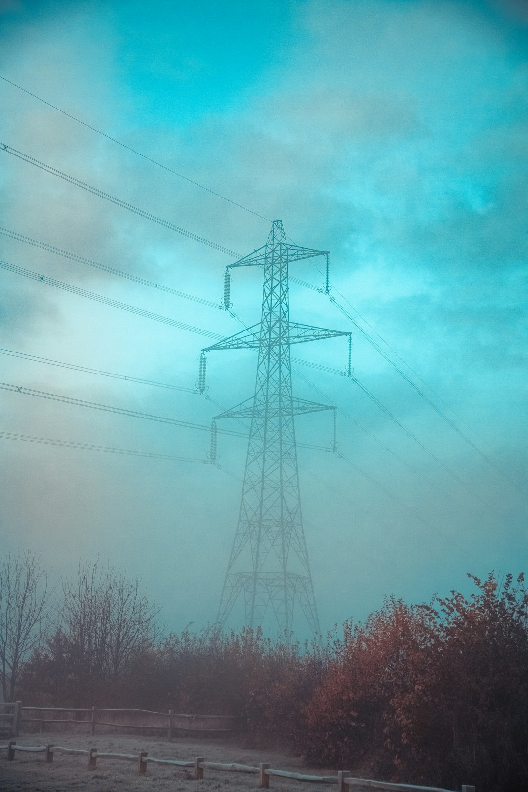 gray transmission tower during daytime